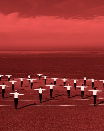 A large group of people with outstretched arms stand in a circle on a field, all colored in shades of red.