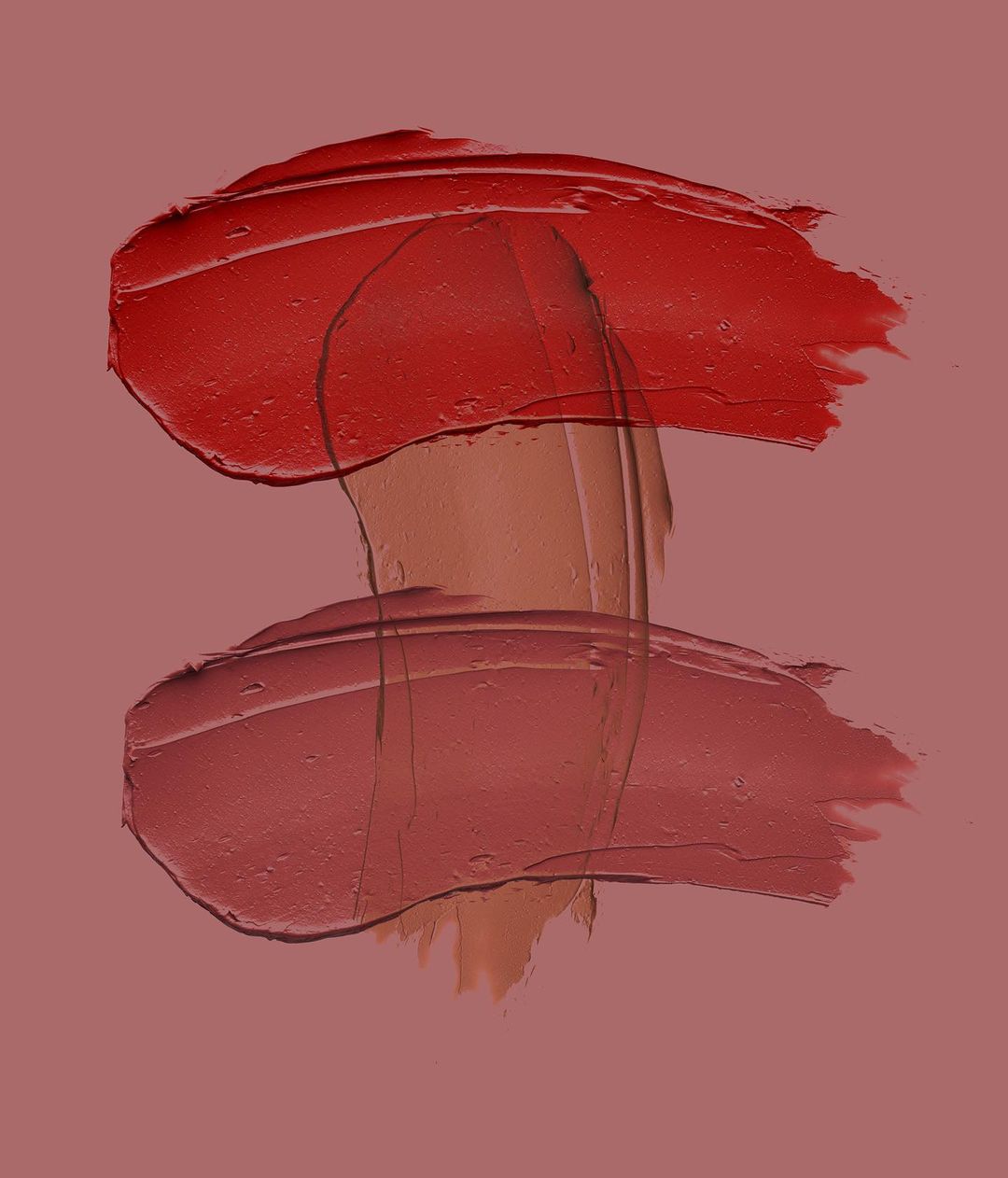 Abstract beauty shot of lipstick swatches in red and pink hues on a matching pink background, showcasing texture and color for beauty advertising.