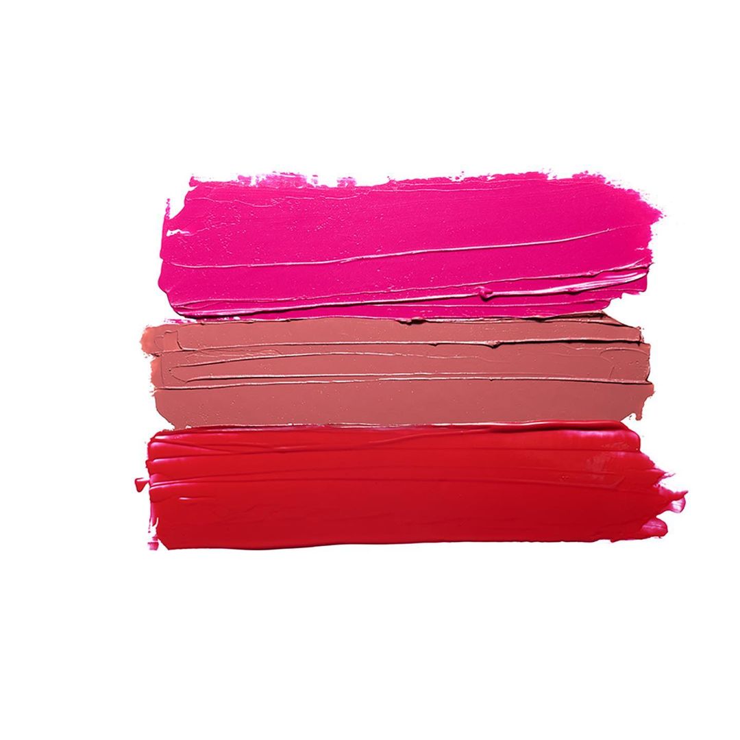 Three textured swipes of lipstick in red, pink, and nude tones against a bright white background in a makeup advertisement.