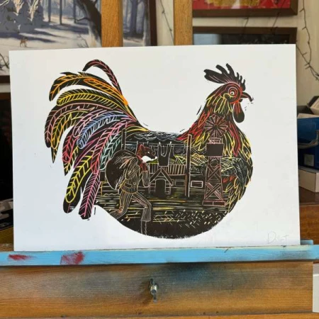 Colorful linocut print of a rooster with detailed imagery of a fox carrying a sack, village structures, and a tower within its body.
