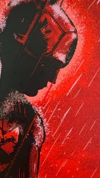 Illustration of a superhero with a mask in a red and black color scheme, with light streaks suggesting rain, rendered in a stylized, graphic art style.