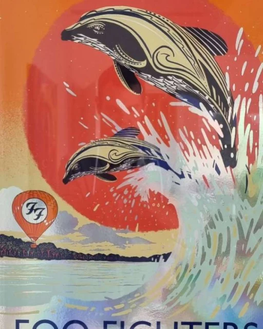 Illustration of two dolphins jumping out of the water in front of a rising sun, and a hot air balloon in the background.