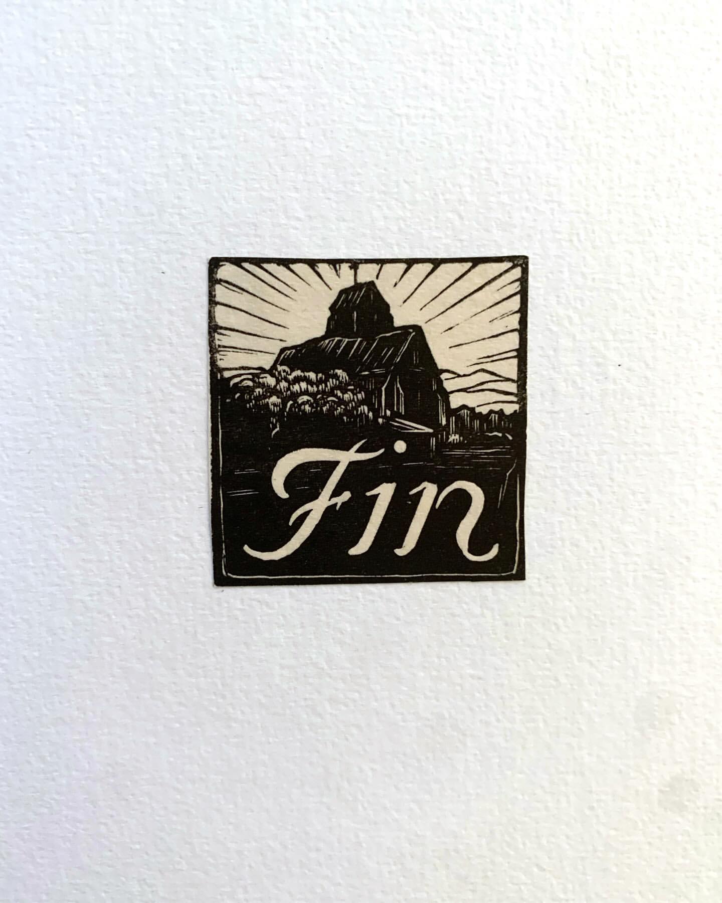 Black and white illustration of a barn with the word "Fin" in script lettering on a white background.