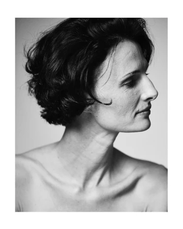 Monochrome portrait profile of a woman with short dark hair against a plain studio background by Pete Thompson.