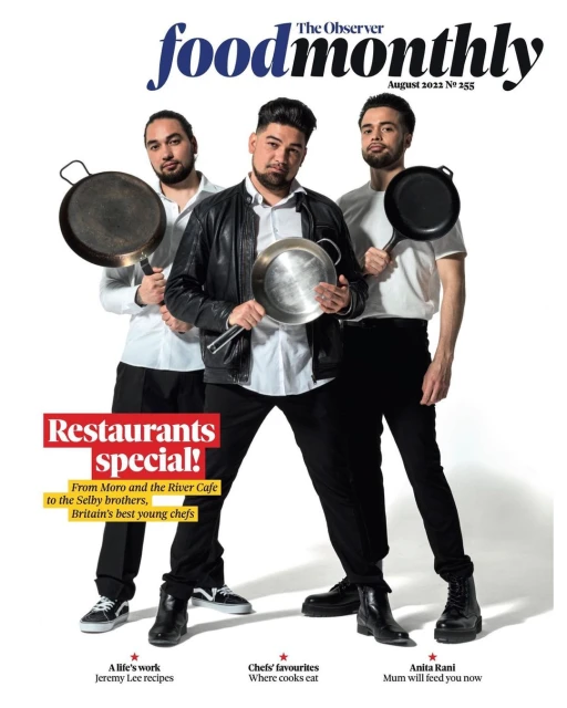 Foodmonthly magazine cover featuring three chefs holding frying pans, showcasing restaurants and chefs. August 2022 issue.