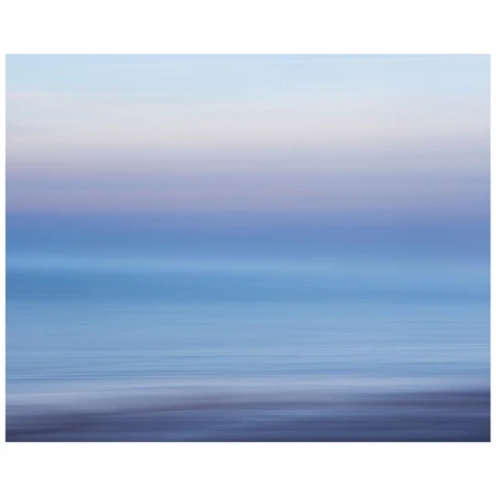 Abstract ocean and sky blend in a long exposure shot, creating a serene, dreamy seascape with smooth water and soft pastel colors.