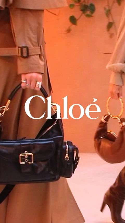 Two women showcase Chloé purses in a fashion editorial with a light peach background and a neutral color palette.