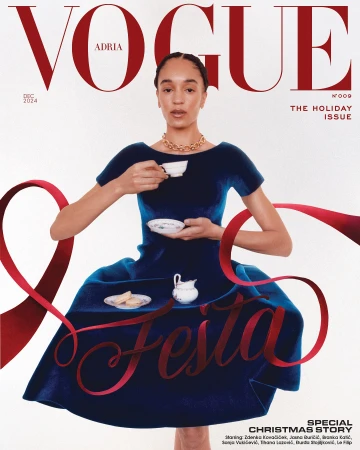 Vogue Adria cover featuring a woman in a blue dress holding a tea cup, with red ribbon accents and holiday-themed text overlays.