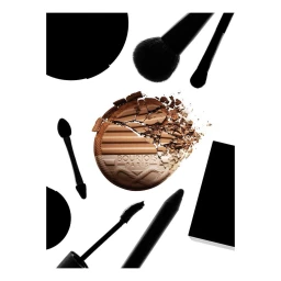 Crushed bronzer compact surrounded by makeup brushes and applicators on white