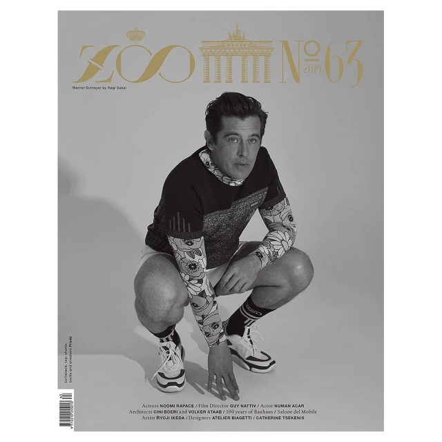 Zoo Magazine cover featuring a man in a patterned shirt and shorts crouching down. The magazine's logo and issue number are at the top.