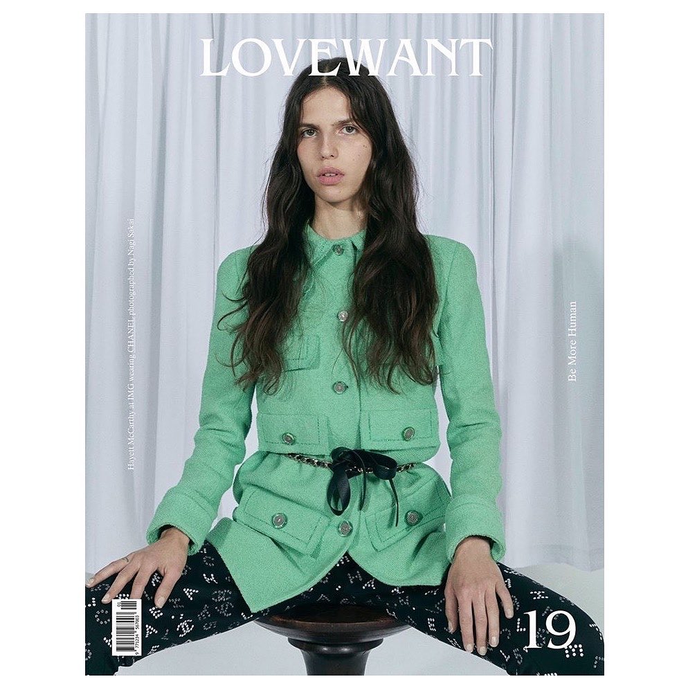 Magazine cover featuring a woman with long hair in a green jacket, sitting on a stool, with the 'LOVEWANT' title.