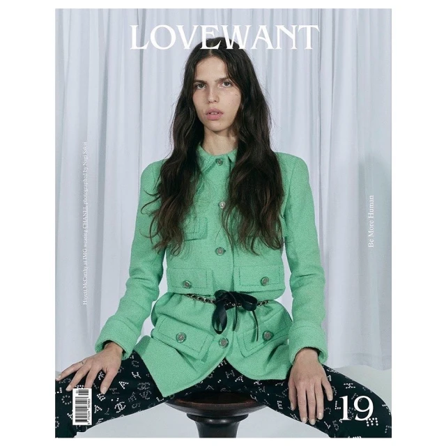 Magazine cover featuring a woman with long hair in a green jacket, sitting on a stool, with the 'LOVEWANT' title.