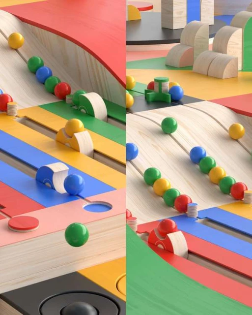 Eye-level shot of a colorful toy marble run with wooden toy cars and wood geometrical building blocks on a light woodgrain background.