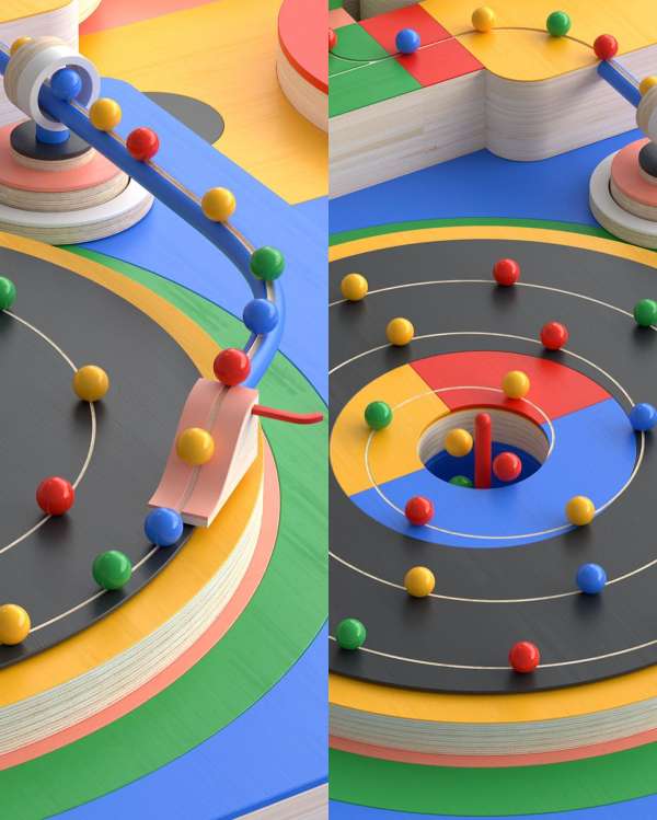Colorful art installation with wooden geometric platforms and multi-colored spheres on ramps and circular platforms; vibrant and modern design.