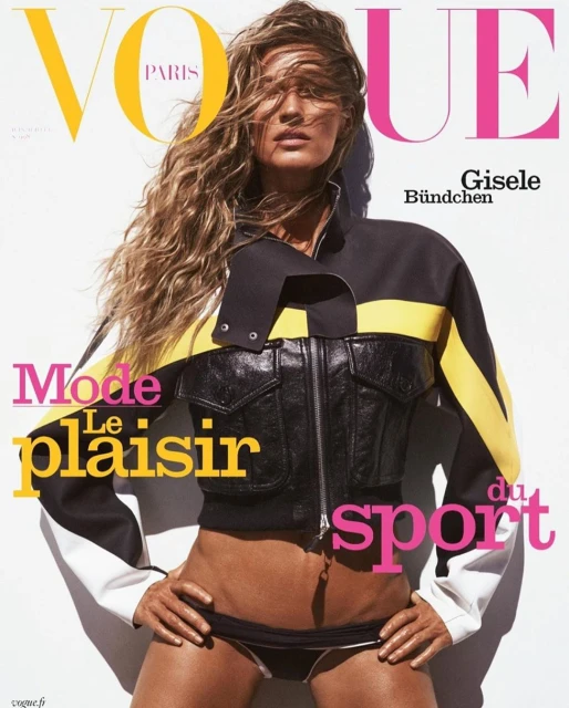Vogue cover featuring Gisele Bundchen in a black and yellow jacket and bikini bottom against a white background with magazine text.