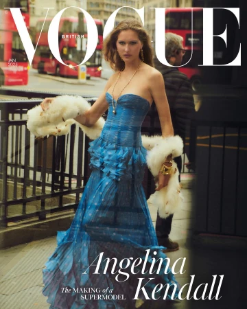Vogue cover featuring a fashion model wearing a blue dress and faux fur stole, posing on a city street with a double-decker bus in the background.