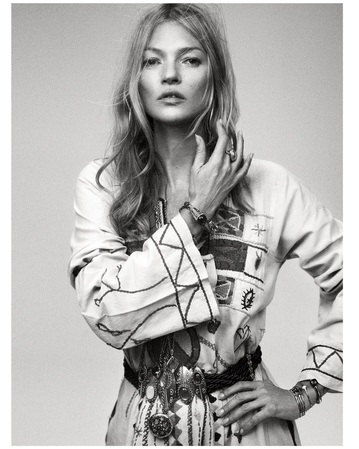 Black and white portrait of a woman wearing an embroidered patterned tunic and decorative belt by Mikael Jansson