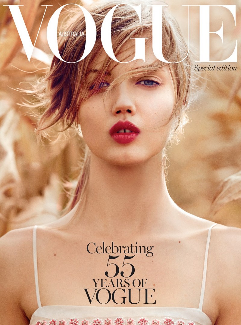 Vogue Australia cover featuring a close-up of a young woman with fair skin and blonde hair, wearing a dress with thin straps.
