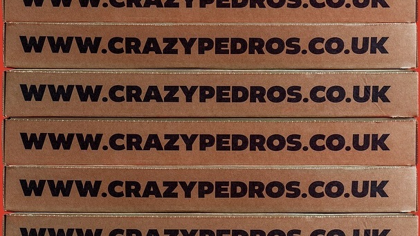 Multiple tan boxes stacked with 'WWW.CRAZYPEDROS.CO.UK' printed in bold black lettering. Food and beverage theme.