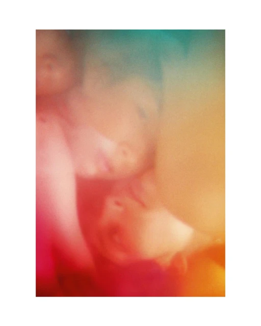 Soft-focus image of two children with fair skin, rendered with a dreamlike, ethereal aesthetic and a warm, pink and orange color palette.