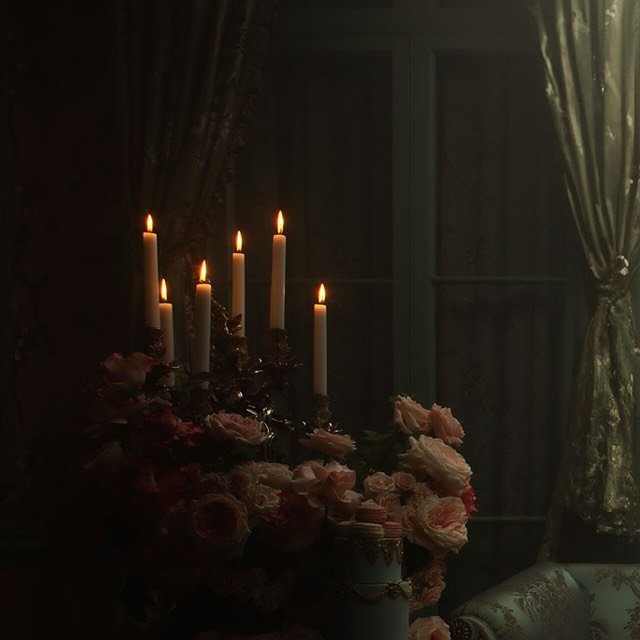 A dimly lit image of a candelabra with lit candles on a table with flowers and an antique chair in a dark interior setting.