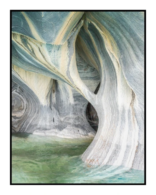 Marble Caves of Chile Chico, Chile, reflecting in turquoise lake waters, creating a natural stone landscape with unique patterns and textures.