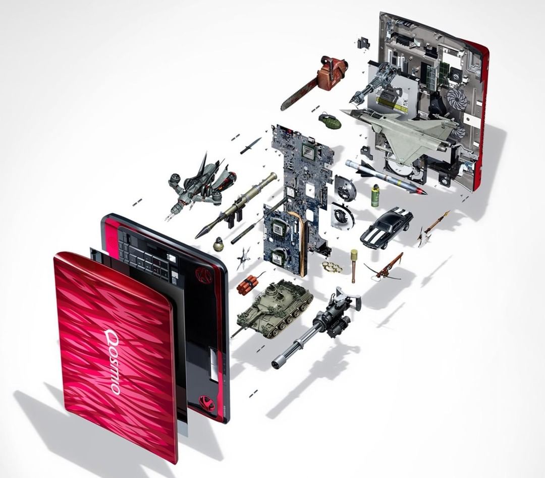 Exploded view of a red laptop showing internal components and miniature war-themed objects such as a tank, fighter plane, and weapons.