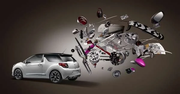 Silver compact car with exploded view of parts floating, presented in a studio setting with controlled lighting. Automotive concept.