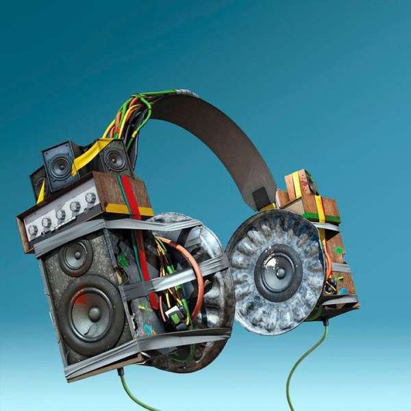 Artistic headphones made from speaker components and wiring against a blue backdrop, showcasing a unique audio equipment concept.