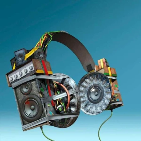 Artistic headphones made from speaker components and wiring against a blue backdrop, showcasing a unique audio equipment concept.