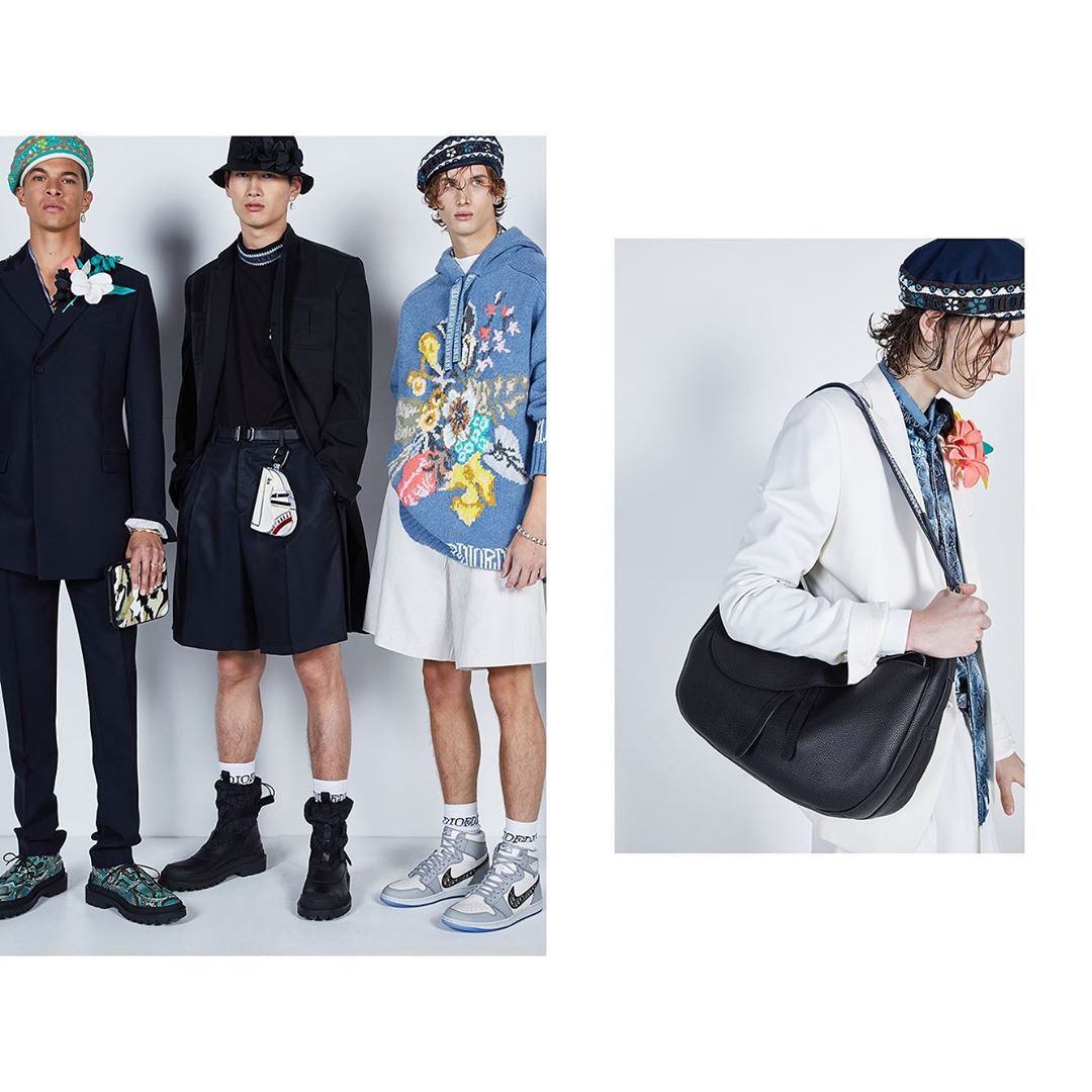 Fashion editorial featuring four young adult men wearing haute couture designs in a brightly lit, neutral indoor setting showcasing current styles.