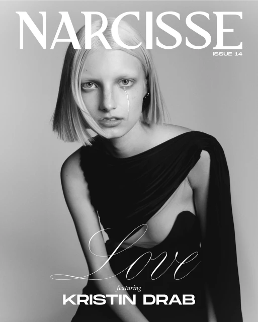 Black-and-white fashion magazine cover featuring a young woman with short blonde hair and a black dress, dramatic tear on her face.