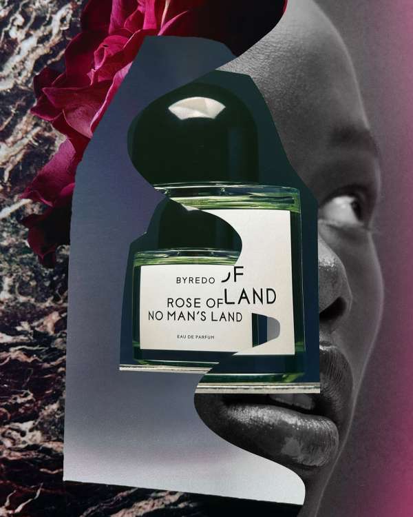 Byredo 'Rose of No Man's Land' perfume bottle with floral and face collage elements, beauty product marketing shot.