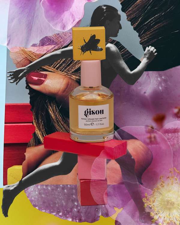 Gisou hair perfume and packaging displayed against a collage background with flowers, a figure, and blocky geometric shapes.