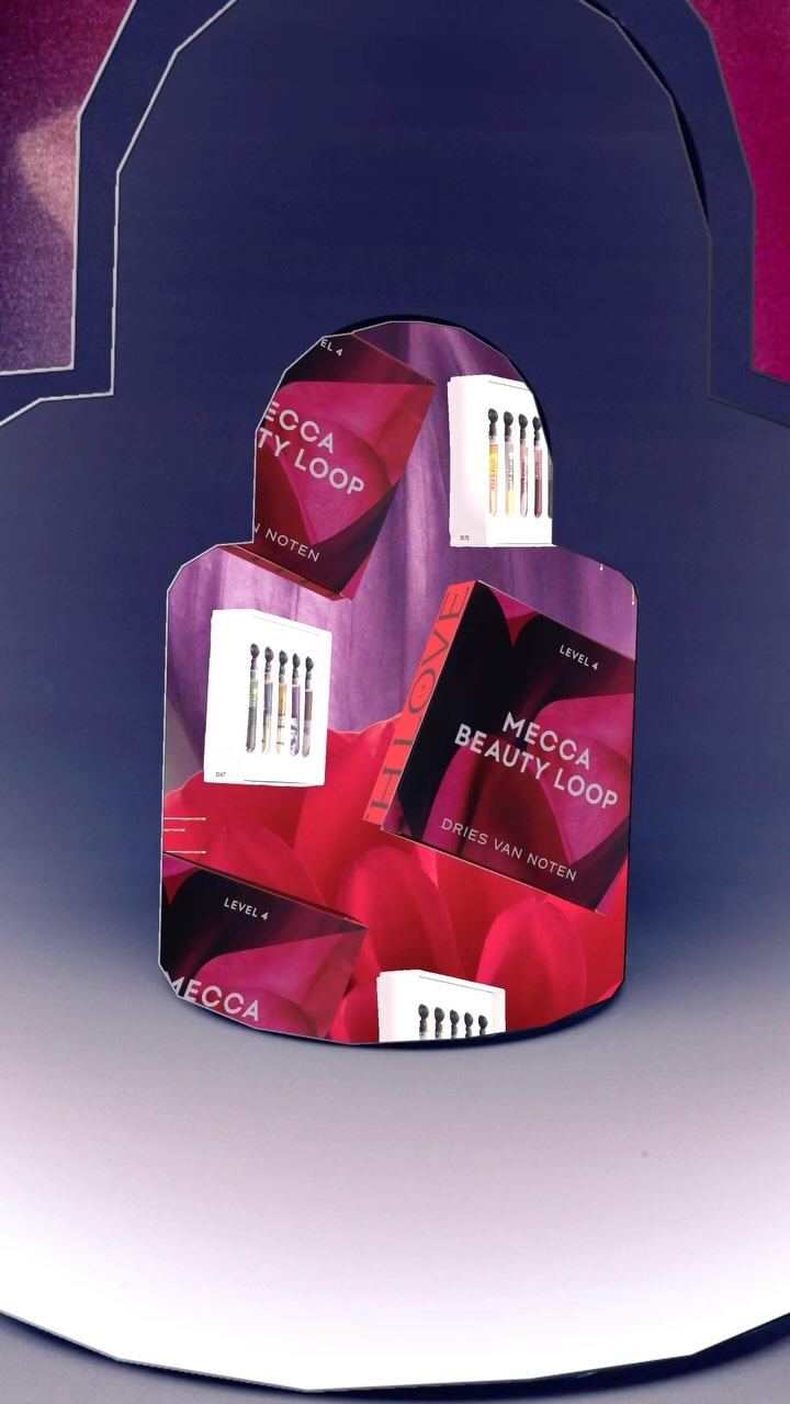 Display of Mecca Beauty Loop packaging featuring a collection of sample products, showcasing a variety of textures and colors, indoors.