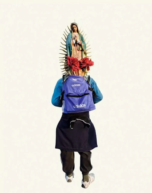 Person carries statue of Virgin Mary with flowers on backpack, Adidas branding is visible, against a white background in a medium shot.