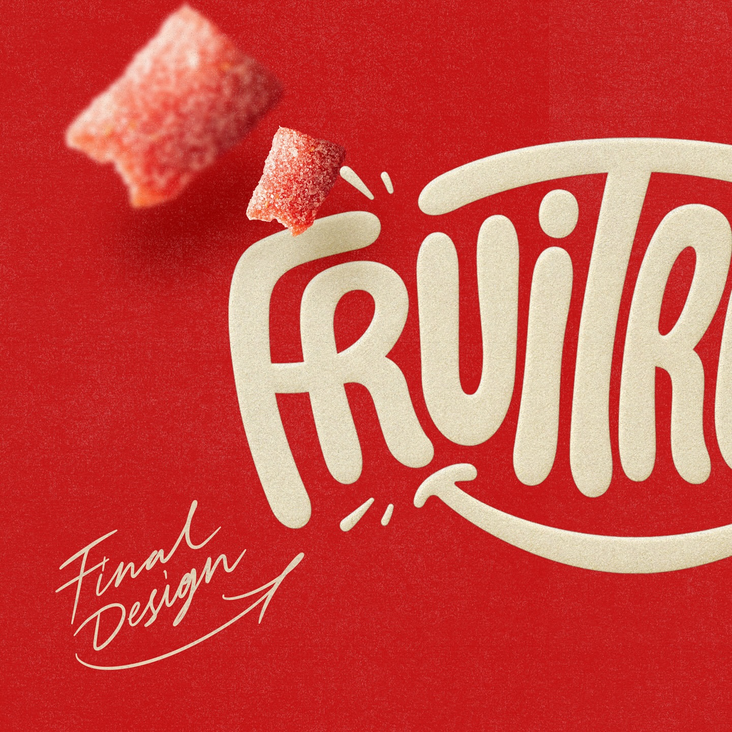 Close-up studio shot of two red, sugar-covered fruit candy pieces with the logo "FRUITR" against a textured red background.