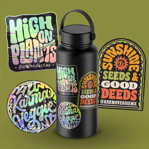 Black water bottle covered in holographic stickers with plant and sunshine themes against a soft green backdrop in a product shot.