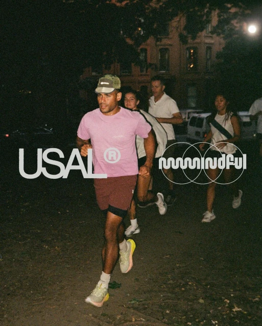 Group of diverse adults running outdoors in activewear at night, showcasing fitness, community, and urban night scene.