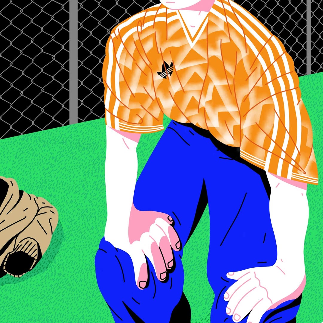 Illustration of a man in a soccer jersey and blue pants kneeling on a green field with a chain-link fence in the background.