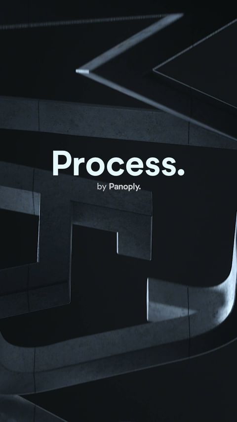 Abstract dark gray background with light gray geometric shapes and the words 'Process by Panoply' in white text.