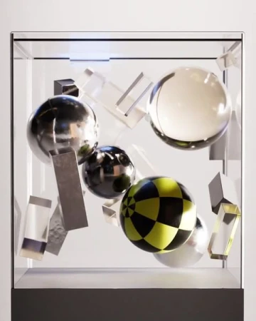 Geometric art installation in transparent display case featuring spheres and rectangular shapes in silver, yellow, and transparent acrylic.
