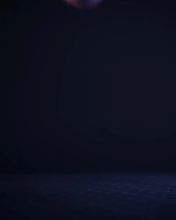 Dark, low-key image of a room with a blue-gray floor, shot in a photo studio. The background is a gradient of dark blue to black.