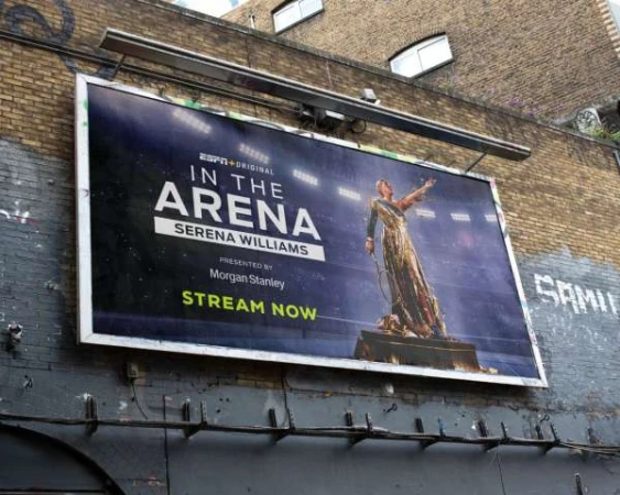 Billboard advertisement for ESPN's 'In the Arena' documentary featuring Serena Williams, presented by Morgan Stanley, encouraging viewers to stream now.