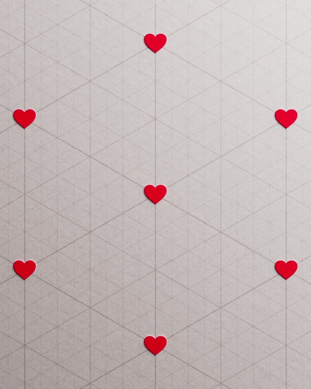 Overhead shot of seven red heart shapes evenly spaced on white triangular grid pattern for Valentine's Day or design concept.