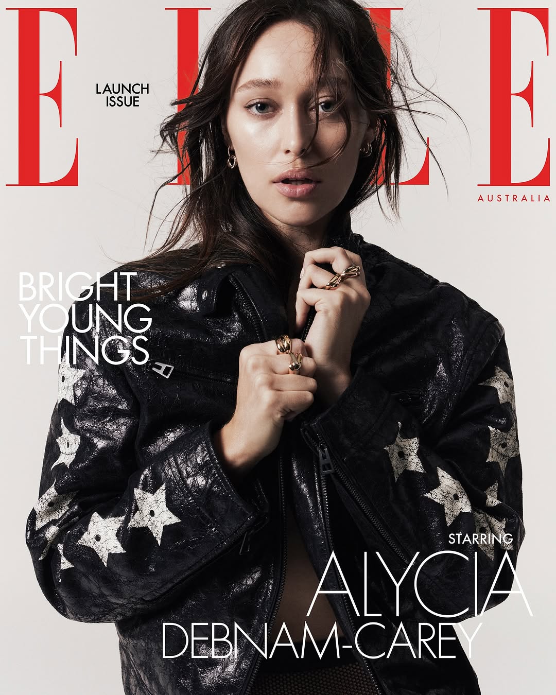Elle Australia magazine cover featuring adult female wearing a black jacket with white stars, against a neutral background.