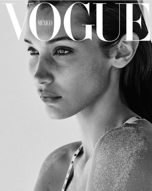 Close-up portrait of a young woman with sand on her face and shoulder, featured on the black-and-white cover of Vogue Mexico.