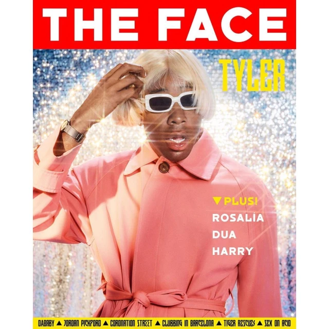 Magazine cover featuring a person with fair skin, wearing sunglasses and a two-tone pink coat, posing in front of a sparkling backdrop.