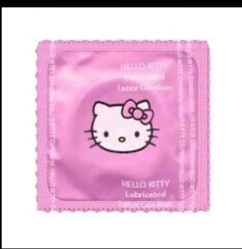 A pink foil package with Hello Kitty printed on it, isolated on a white background, featuring a distinctive scalloped edge.