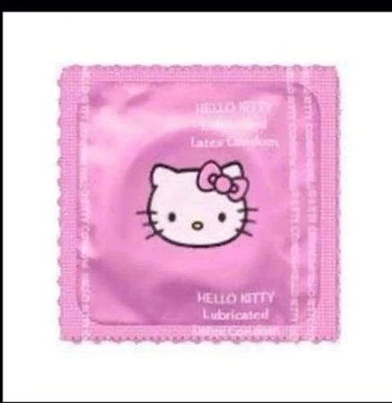 A pink foil package with Hello Kitty printed on it, isolated on a white background, featuring a distinctive scalloped edge.